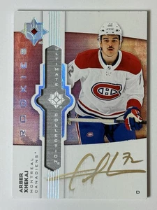2022-23 Ultimate Collection Arber Xhekaj Emblems Auto Rookies RC UE-AX Canadiens - Bild 1 von 4