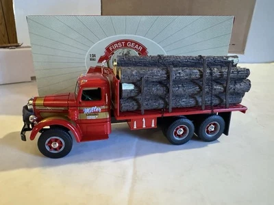 First Gear 1/34 Diecast Miller Logging Mack L Series Logging Stake Truck w/ Box - Image 1 of 4