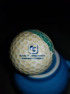 Premium Entschädigung Versicherung Firmenlogo Golfball - Bild 1 von 1
