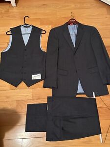 Tommy Hilfiger 3 piece Gray Striped suit (36R). “Trim fit”. 100% wool.