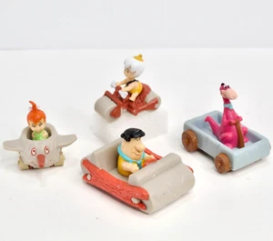 Lotto 4 giocattoli vintage 1990 Dennys Flintstones veicolo preistorico Fred Pebbles - Foto 1 di 9