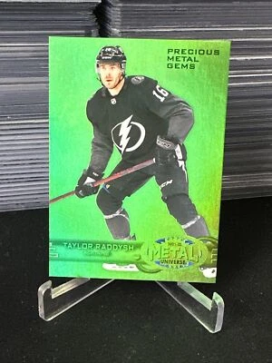 2021-22 Skybox Metal Universe Taylor Raddysh 1997-98 Retro PMG Green /10 RC - Image 1 of 4
