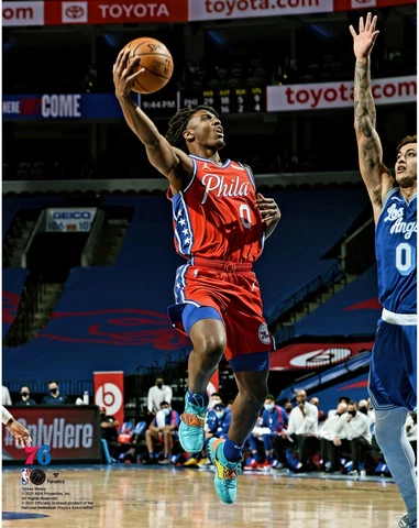 Tyrese Maxey Philadelphia 76ers Unsigned Lay Up in Red Photo Cover