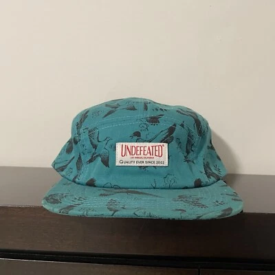 GORRA CAMPAMENTO PATO INVICTO 5 paneles TEAL Foto 1 de 4