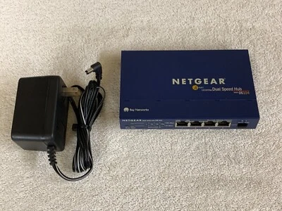 Netgear DS104 4-Port 10/100 Dual Speed Hub w/OeM power adapter - Image 1 of 4