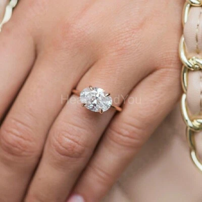 1.2 克拉椭圆形切割模拟钻石东西方订婚戒指 14k 镀玫瑰金 — 第 1/4 张图片