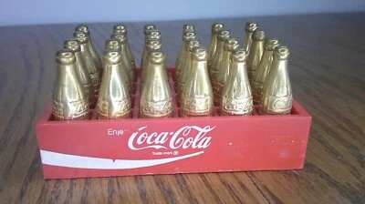 vintage Coca Cola plastic case w/ 24 brass mini bottles of Coca Cola        Z141 - Image 1 of 4