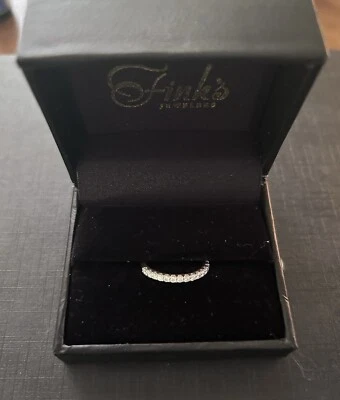 Platinum Eternity Wedding Band with 18 Round Diamonds - Fink’s Jewelers - Image 1 of 4