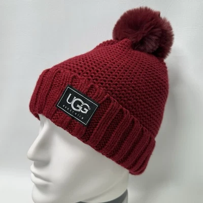 Gorro tejido con cable UGG Australia súper suave forrado de piel sintética granate rojo pompón Foto 1 de 4