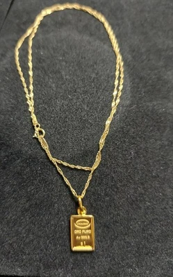 24k YG 1 Gram Ingot Gold Bar Set In 10k Frame With 14k Gold Chain - Image 1 of 4