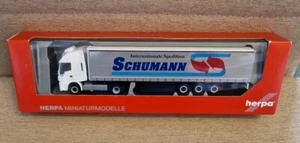Herpa 310048 Schumann Iveco Stralis Gardinenplanen-Sattelzug OVP - Bild 1 von 2