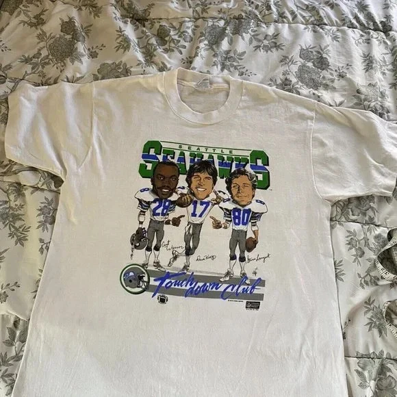 Seattle Seahawks Caricatura Vintage Blanco Camiseta QT5188 Foto 1 de 3