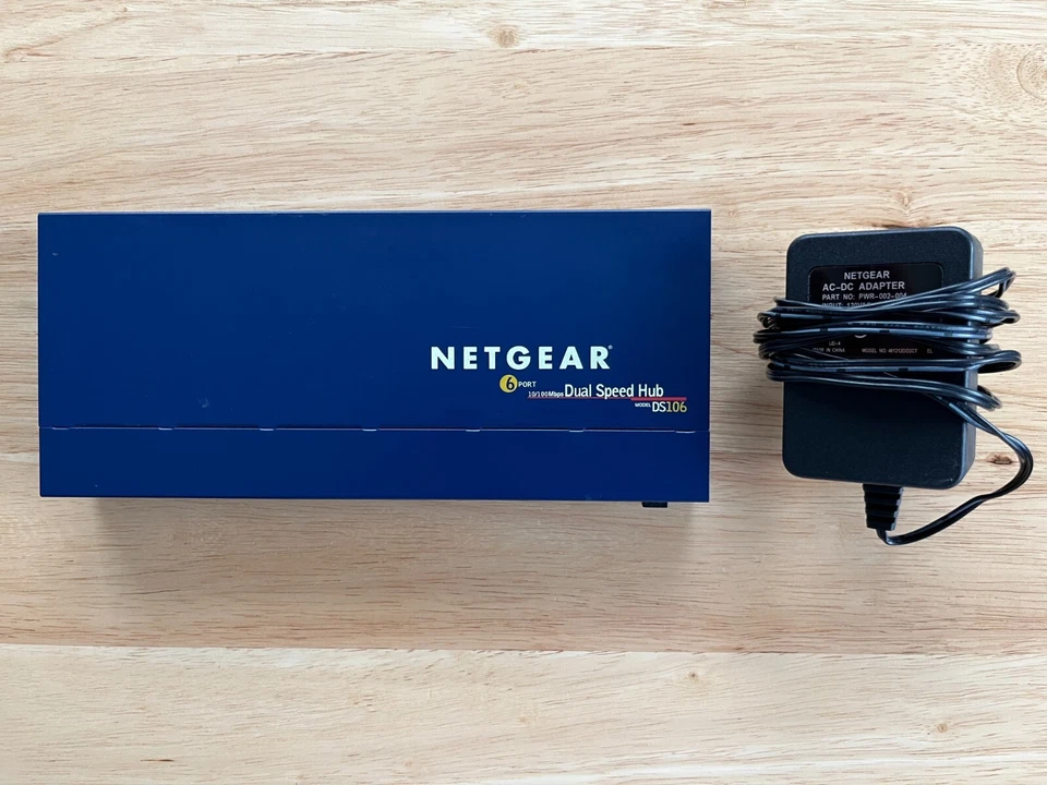 Netgear 6-Port 10/100 Dual Speed Ethernet Hub w/ Uplink Button - Model DS106 - Image 1 of 4