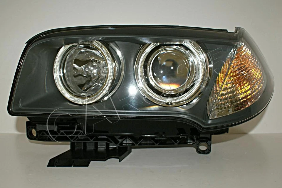 Faro delantero bi xenón AFS IZQUIERDO para BMW X3 E83 2006 Foto 1 de 4