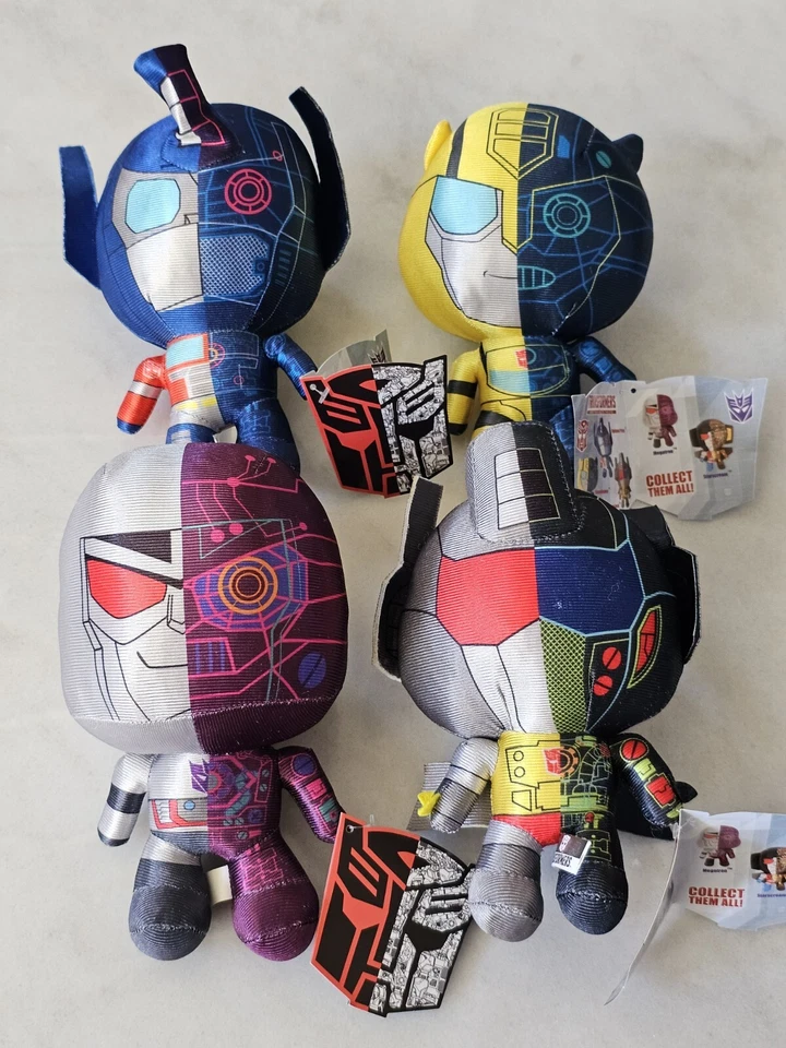 Transformers More Than Meets The Eye Juego de 4 Peluches Metálicos Edición Limitada NUEVO Foto 1 de 4