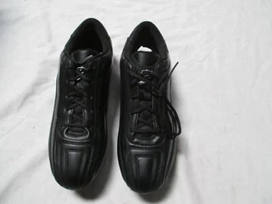 Botines de fútbol americano bajos Easton Torch negros con picos intercambiables (varios tamaños) - Imagen 1 de 5