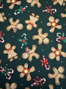 CHRISTMAS FAVORITES BY QT GINGERBREAD FAMILY ON GREEN COOKIES FABRIC HALF YARD - Picture 1 of 3