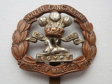GOOD ORIGINAL SOUTH LANCASHIRE PRINCE OF WALES'S VOLUNTEERS REGIMENT CAP BADGE