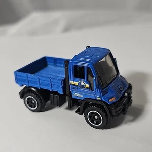 Matchbox Mercedes-Benz Unimog U300 2006 Blue Byrd Farms 1:64 camion pressofuso - Foto 1 di 13