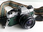 Olympus OM10 35mm SLR Film Camera Bundle | 28mm Lens | Strap | Green Leather