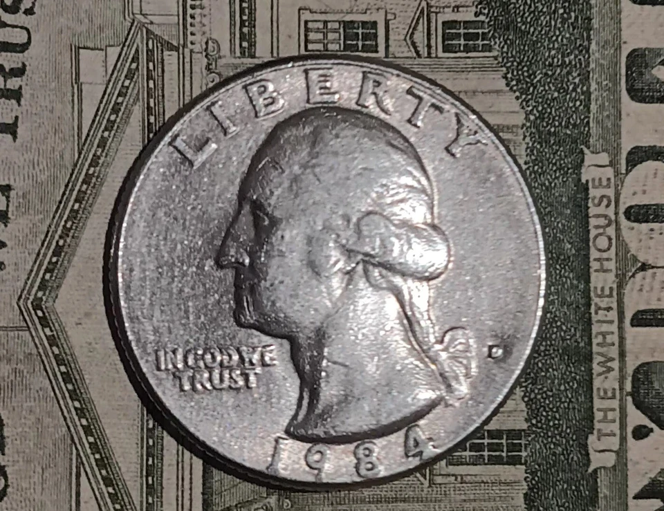 1984 Quarter D Mint Mark W/ Errors. Small Mint Mark . Large “In God we Trust.” - Image 1 of 3