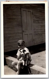 1950s Original Snapshot Photograph Boy In Military Hat Holding Puppy Dog - Picture 1 of 2