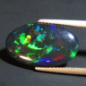 Piedra preciosa ovalada de ópalo negro juego multicolor natural de 7,20 quilates de Etiopía - Imagen 1 de 4