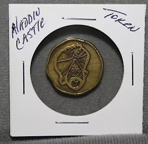 ALADDIN'S CASTLE - 8 SIDED ARCADE TOKEN - GENIE/CASTLE - Picture 1 of 2
