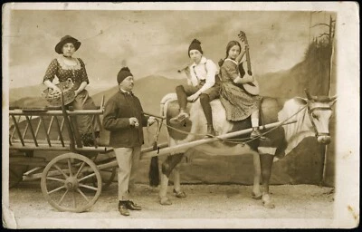 funny family in cow cart, musical instruments, pipe, guitar, unusual, MERAN - Image 1 of 4