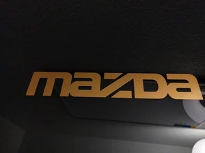 Paquete de 2 calcomanías adhesivas de vinilo metálico dorado brillante logo Mazda 15,75" x 2,75" - Imagen 1 de 6