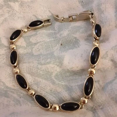Pulsera vintage Liz Claiborne tono dorado 7" ovalada resina negra cabuchones  Foto 1 de 2