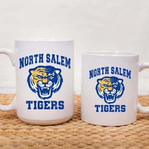 Tazas con logotipo de North Salem Tigers - disponibles en 11 oz. o 15 oz. - Imagen 1 de 3