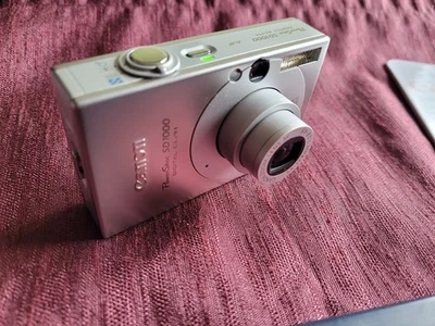 Canon Digital Ixus 70 Digitalkamera 7.1 MP PowerShot SD1000 CHDK - Bild 1 von 4