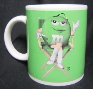 10 oz Green Girl M&M Ceramic Coffee Mug Go Go Boots Director's Chair - Picture 1 of 6