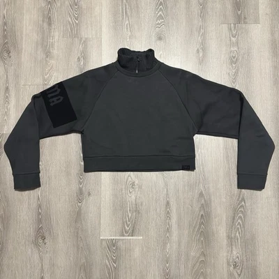 Suéter negro Puma Fenty by Rihana para mujer pequeño cuello recortado cremallera Foto 1 de 4