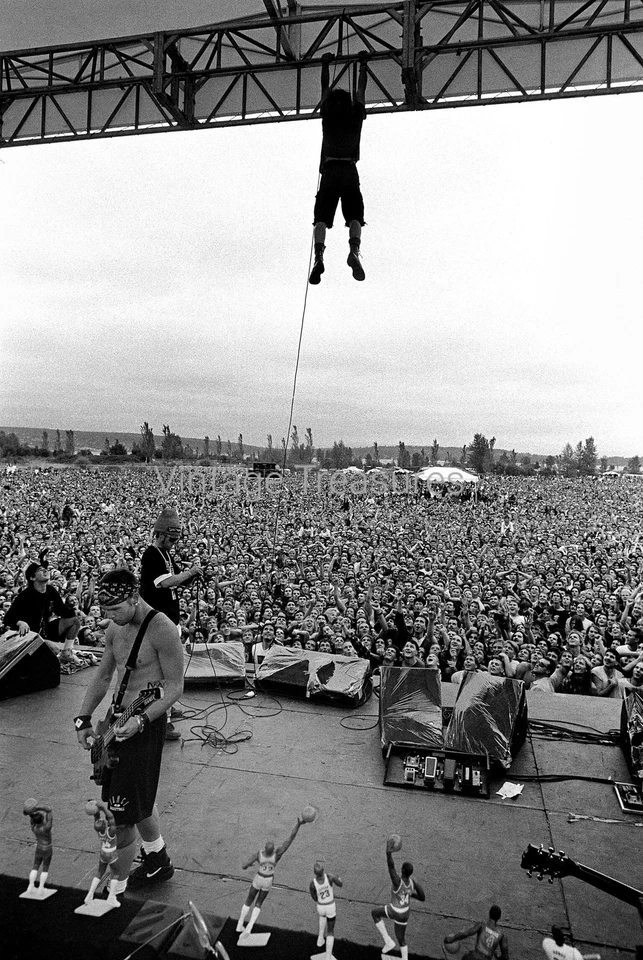 Eddie Vedder of Pearl Jam Hanging from Rafters Photo Print Poster - Image 1 of 1