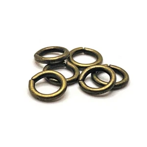 100, 500 o 1.000 piezas a granel anillos de salto abiertos de bronce de 7 mm de espesor - vendedor de EE. UU. - BR888 - Imagen 1 de 2