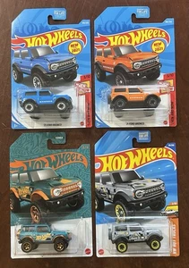 Hot Wheels 2021 FORD BRONCO - 4er Set - Blue Orange Grey Pearl & Chrome Trucks - Bild 1 von 6