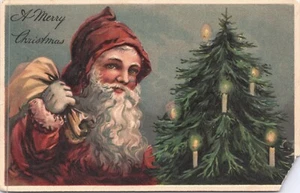 A Merry Christmas - Santa with bag Candle lit tree in background - 1921 - Picture 1 of 2
