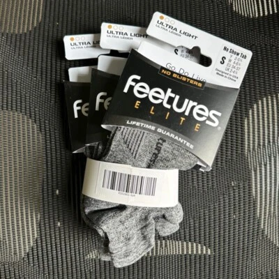 3 pares de calcetines grises Feetures Elite ultra ligeros sin mostrar talla S 4-6,5 para mujer Foto 1 de 3