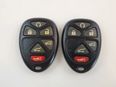 ORIGINAL LOT OF 2 GMC CHEVROLET CADILLAC 07-13 OEM KEY LESS ENTRY REMOTE FOB GM - Image 1 of 4