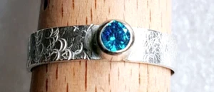 Striking Sterling Silver 4mm patterned wide band and 4mm Aquamarine CZ, Ring. - Picture 1 of 2