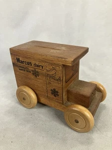 Vintage wooden piggy bank shaped like a delivery truck, branded "Marcus Dairy - Picture 1 of 9