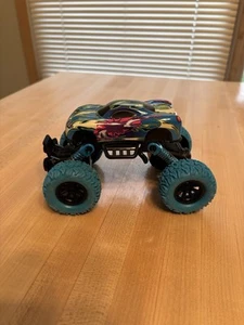 Off Road Inertia Stunt Vehicle Monster Truck 4WD Metal w/ Suspension 1:64 - Picture 1 of 9