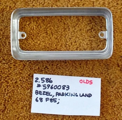 Oldsmobile F85 1968 bisel de lámpara de estacionamiento NOS 5960083 Foto 1 de 4