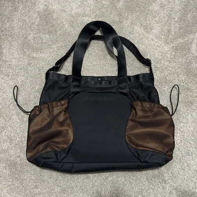 Bolso de Mano Lululemon Saul Nash SLNSH Negro y Naranja Foto 1 de 4