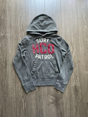 Sudadera con Capucha Y2K Hollister Para Hombre Talla Pequeña Gris Surf HCO California De Colección Foto 1 de 4