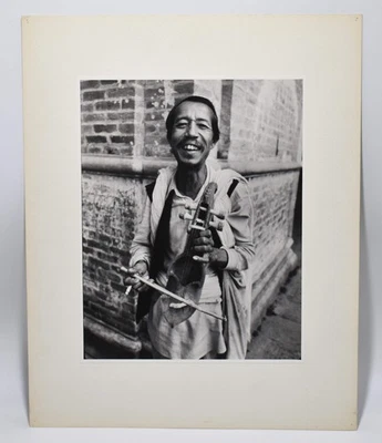Vintage James W. Howlett Black and White Photograph, 'Strolling Fiddler - Nepal' - Image 1 of 4