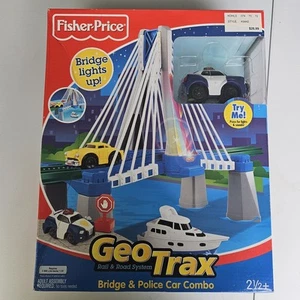 GeoTrax Leuchtbrücke & Polizeiauto Kombi Fisher Price Rail & Road System K9442 - Bild 1 von 10