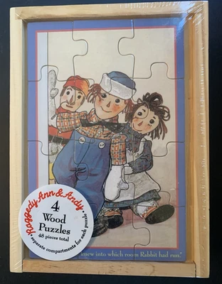 Schylling Raggedy Ann & Raggedy Andy Puzzle set of 4 Wood Puzzles in Storage Box - Image 1 of 4